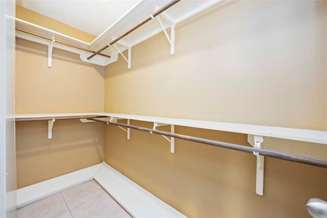 11510 Pagoda Dr, Houston, TX 77477 - spacious closet featuring tile patterned floors