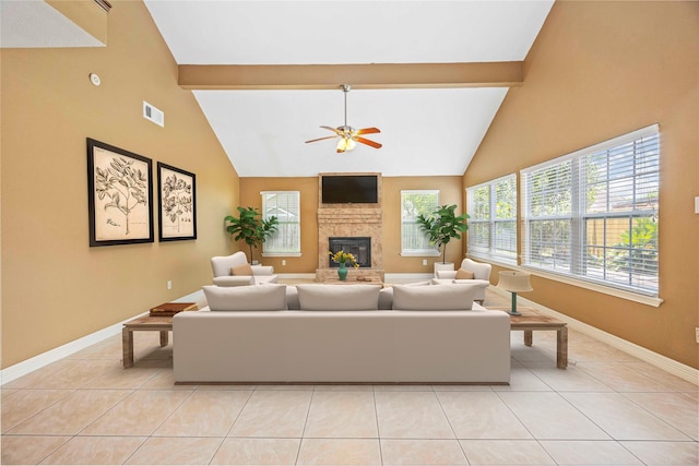 11510 Pagoda Dr, Houston, TX 77477 - living area with healthy amount of natural light, a ceiling fan, beamed ceiling, a large fireplace, and light tile patterned floors