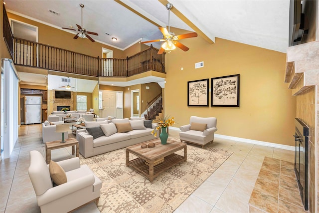 11510 Pagoda Dr, Houston, TX 77477 - tiled living room with a fireplace, ceiling fan, high vaulted ceiling, stairway, and beam ceiling
