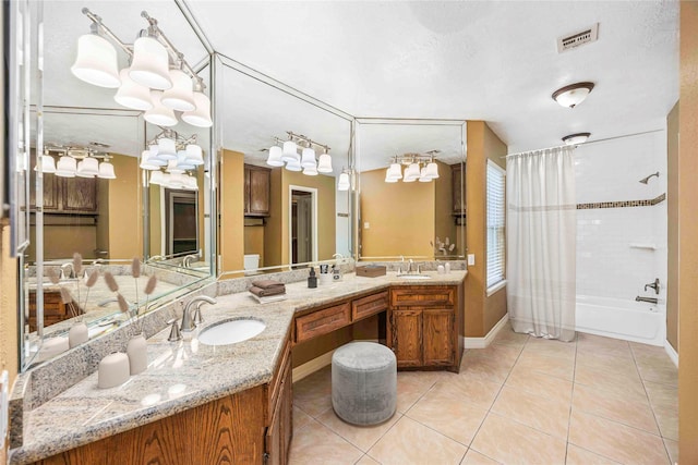 11510 Pagoda Dr, Houston, TX 77477 - full bath featuring tile patterned flooring, double vanity, shower / bath combo, and a chandelier
