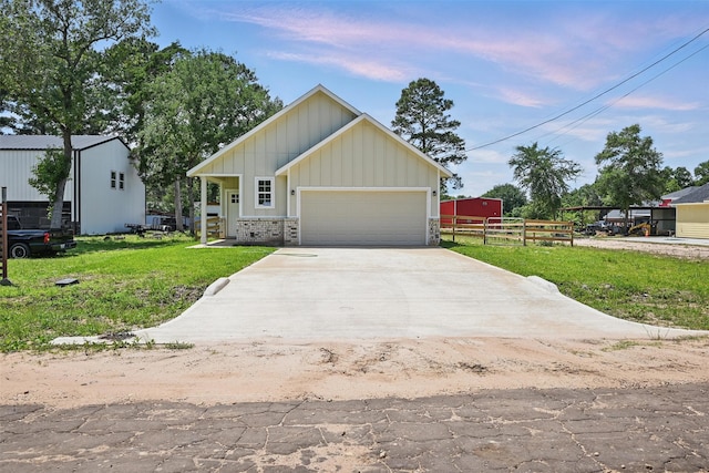 24644 Cavan St, Hempstead, TX 77445 - view of front of home featuring board and batten siding, concrete driveway, and an attached garage