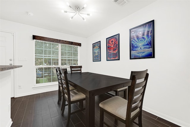 1860 White Oak Dr Unit 251, Houston, TX 77009 - dining room with dark wood-type flooring and a chandelier