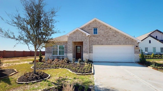 2118 Sanders Brook Dr, Baytown, TX 77521 - view of front of house with stone siding, an attached garage, and concrete driveway