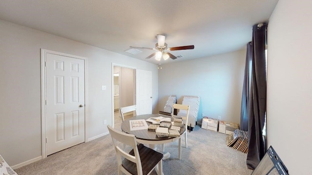 2118 Sanders Brook Dr, Baytown, TX 77521 - dining space featuring light colored carpet and ceiling fan