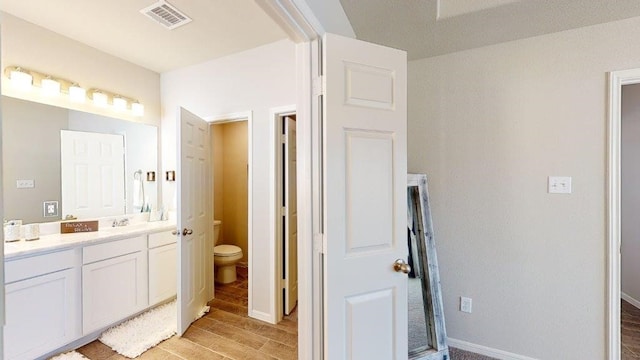 2118 Sanders Brook Dr, Baytown, TX 77521 - bathroom featuring vanity and wood finished floors