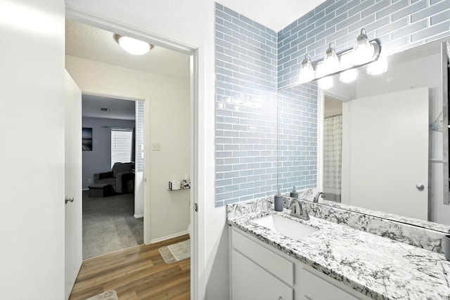 100 Edgewater Dr Unit 39, Livingston, TX 77351 - full bathroom featuring wood finished floors and vanity