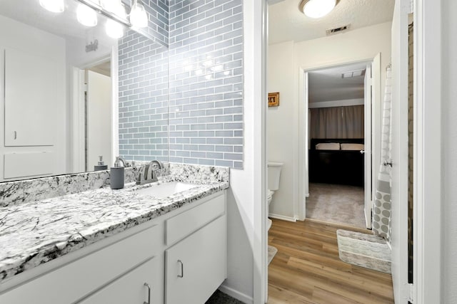 100 Edgewater Dr Unit 39, Livingston, TX 77351 - bathroom with vanity and wood finished floors