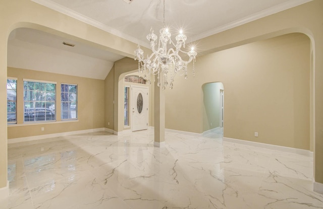 18327 Bluewater Cove Dr, Humble, TX 77346 - spare room with arched walkways, marble tiled floors, a chandelier, and crown molding