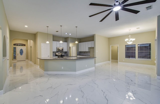 18327 Bluewater Cove Dr, Humble, TX 77346 - kitchen featuring stainless steel microwave, recessed lighting, white cabinets, electric range, and a ceiling fan