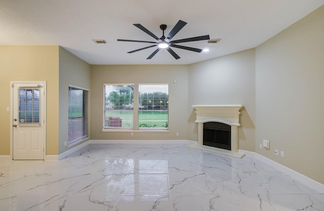 18327 Bluewater Cove Dr, Humble, TX 77346 - unfurnished living room with a ceiling fan, marble tiled flooring, and a fireplace with raised hearth