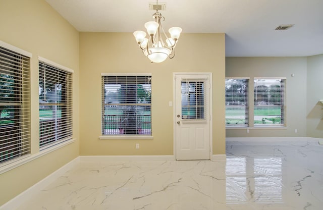 18327 Bluewater Cove Dr, Humble, TX 77346 - unfurnished dining area with marble finish flooring and a chandelier