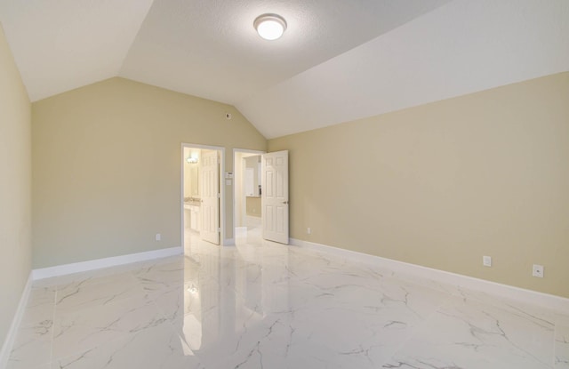18327 Bluewater Cove Dr, Humble, TX 77346 - empty room featuring light marble finish flooring and vaulted ceiling
