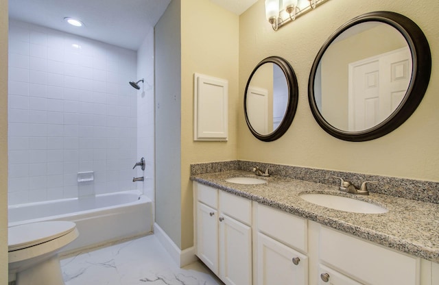 18327 Bluewater Cove Dr, Humble, TX 77346 - bathroom featuring double vanity, marble look tile flooring, shower / bath combination, and recessed lighting