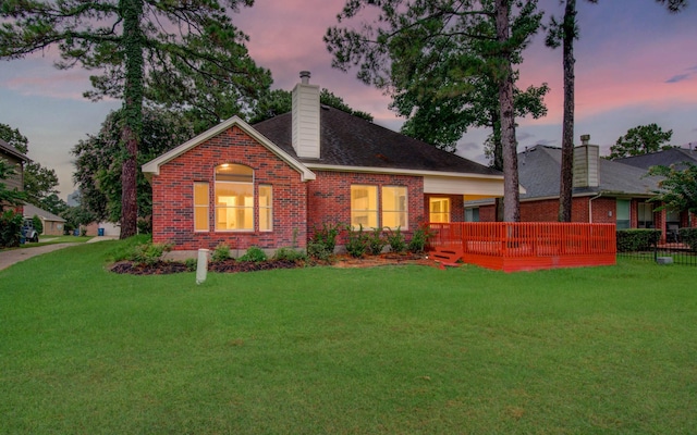 18327 Bluewater Cove Dr, Humble, TX 77346 - view of front of house with brick siding, a chimney, and a wooden deck