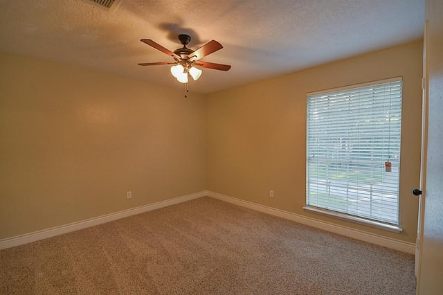 2903 Valley Rose Dr, Kingwood, TX 77339 - carpeted spare room with ceiling fan and a textured ceiling