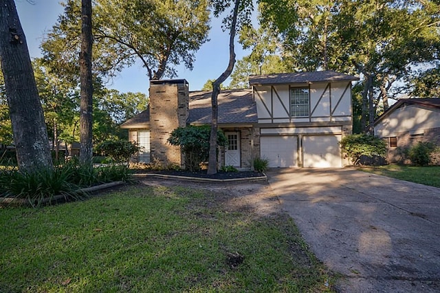 2903 Valley Rose Dr, Kingwood, TX 77339 - tudor house featuring driveway, a chimney, an attached garage, a front lawn, and stucco siding
