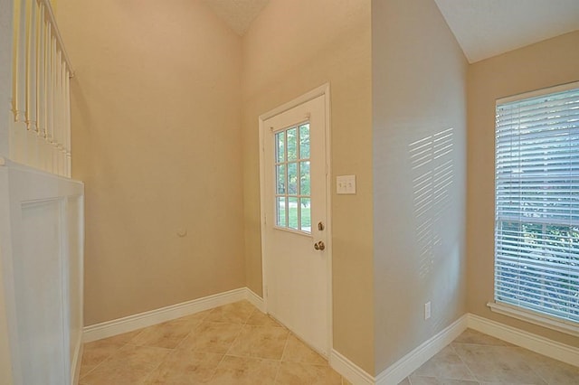 2903 Valley Rose Dr, Kingwood, TX 77339 - doorway featuring light tile patterned floors and lofted ceiling