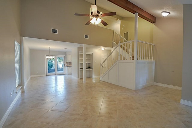 2903 Valley Rose Dr, Kingwood, TX 77339 - unfurnished living room featuring a ceiling fan, high vaulted ceiling, beamed ceiling, stairway, and a chandelier