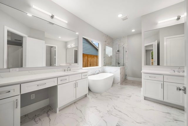 1749 Parana Dr, Houston, TX 77080 - full bath featuring a marble finish shower, two vanities, a freestanding bath, marble look tile flooring, and recessed lighting