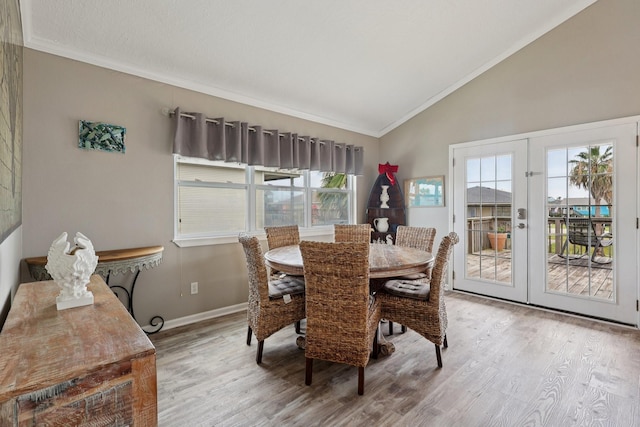 4004 Ector Dr, Galveston, TX 77554 - dining area featuring wood finished floors, vaulted ceiling, french doors, and ornamental molding