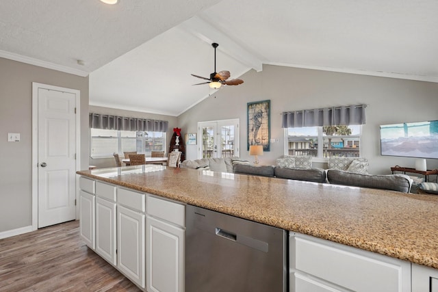 4004 Ector Dr, Galveston, TX 77554 - kitchen featuring dishwasher, open floor plan, light wood-type flooring, healthy amount of natural light, and crown molding