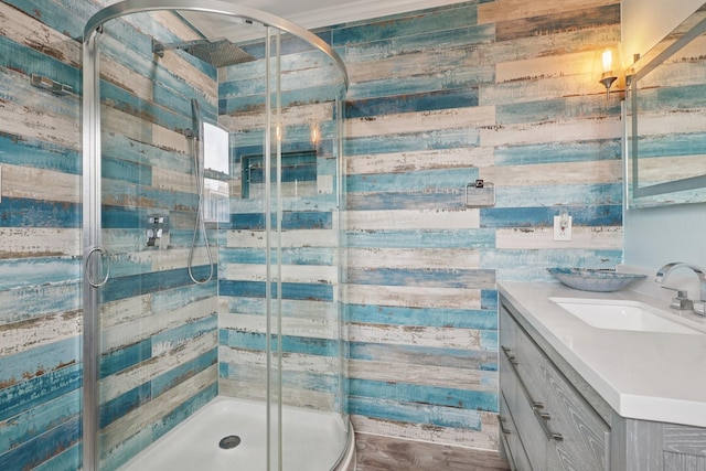 4004 Ector Dr, Galveston, TX 77554 - bathroom featuring vanity, a shower stall, and wood walls