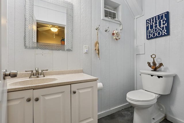 4004 Ector Dr, Galveston, TX 77554 - bathroom featuring vanity, a ceiling fan, and a wall mounted AC