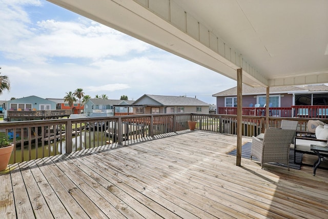 4004 Ector Dr, Galveston, TX 77554 - wooden deck featuring a residential view and a water view