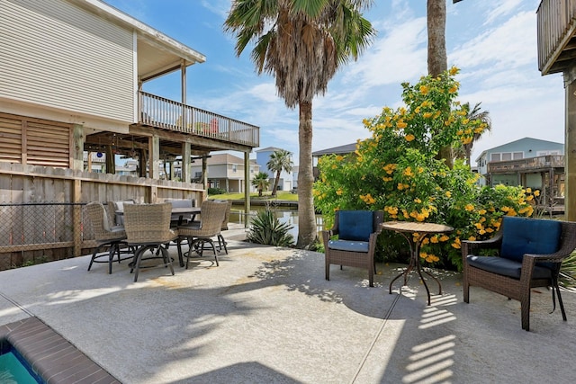 4004 Ector Dr, Galveston, TX 77554 - view of patio featuring outdoor dining area and a water view