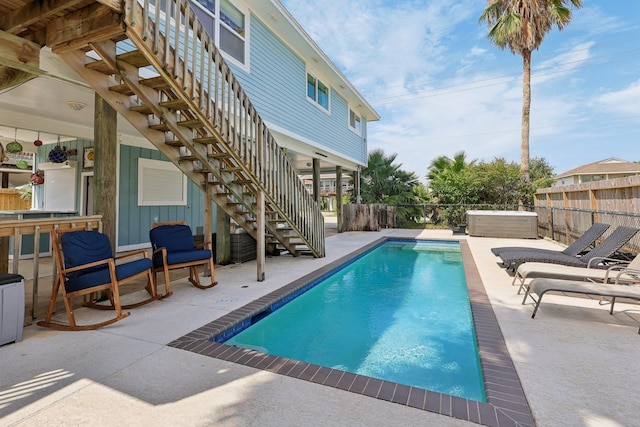 4004 Ector Dr, Galveston, TX 77554 - view of swimming pool with stairs and a patio