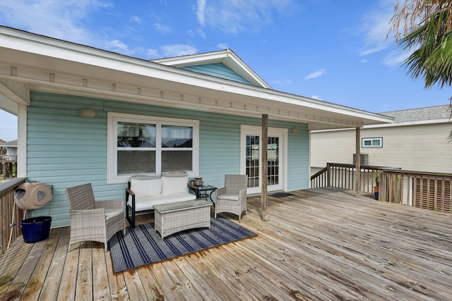 4004 Ector Dr, Galveston, TX 77554 - wooden deck with outdoor lounge area