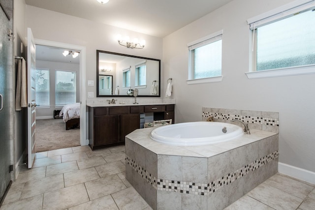 21207 Bradford Grove Dr, Spring, TX 77379 - full bath with a garden tub, vanity, plenty of natural light, and a stall shower