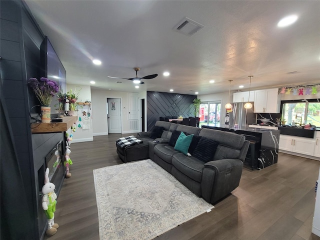 606 E Ahldag St, Wharton, TX 77488 - living room with a fireplace, plenty of natural light, recessed lighting, and dark wood finished floors