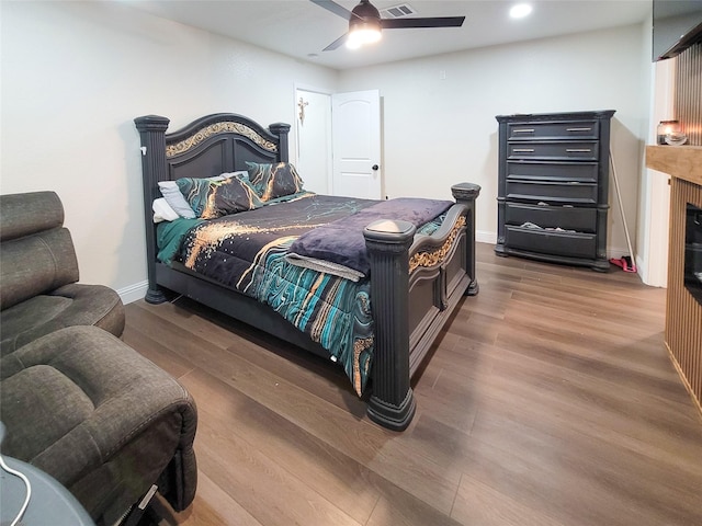 606 E Ahldag St, Wharton, TX 77488 - bedroom featuring wood finished floors, ceiling fan, and recessed lighting