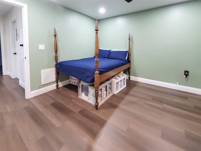 606 E Ahldag St, Wharton, TX 77488 - bedroom featuring wood finished floors and recessed lighting