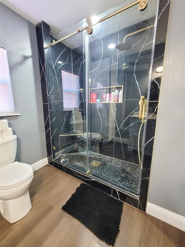 606 E Ahldag St, Wharton, TX 77488 - bathroom with wood finished floors and a marble finish shower