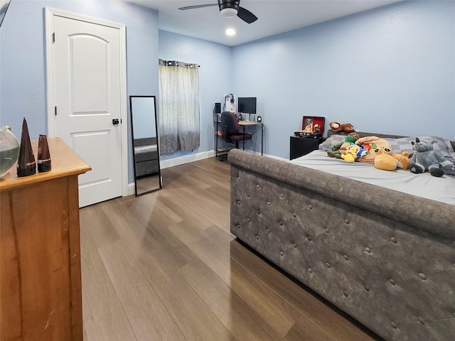606 E Ahldag St, Wharton, TX 77488 - bedroom featuring wood finished floors, an office area, and a ceiling fan