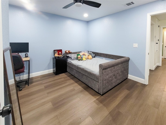606 E Ahldag St, Wharton, TX 77488 - bedroom featuring wood finished floors, a ceiling fan, and recessed lighting