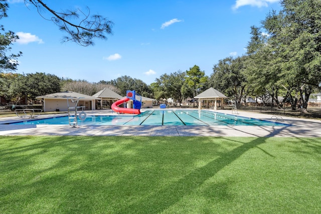 7615 Sandygate Ln, Houston, TX 77095 - community pool featuring a water slide, a gazebo, a lawn, and a patio area