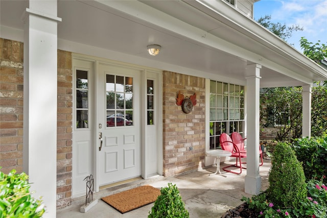 7615 Sandygate Ln, Houston, TX 77095 - property entrance with a porch and brick siding