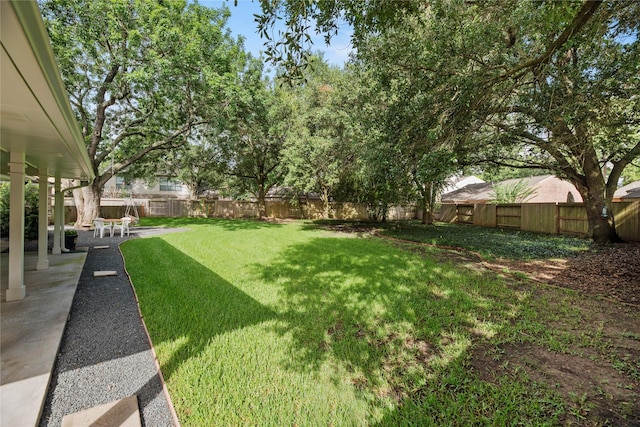 7615 Sandygate Ln, Houston, TX 77095 - fenced backyard with a patio