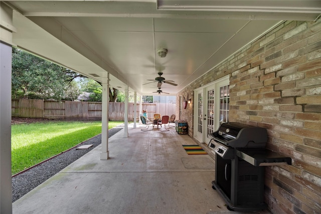 7615 Sandygate Ln, Houston, TX 77095 - fenced backyard featuring french doors, a ceiling fan, a patio, and area for grilling