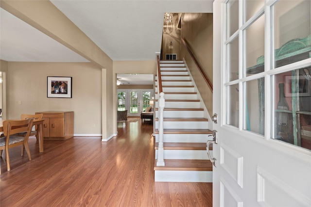 7615 Sandygate Ln, Houston, TX 77095 - stairway featuring french doors, wood finished floors, and a ceiling fan
