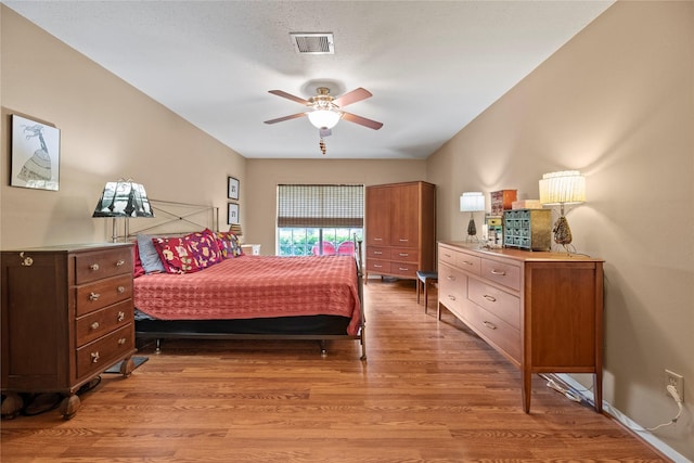 7615 Sandygate Ln, Houston, TX 77095 - bedroom with light wood finished floors and a ceiling fan
