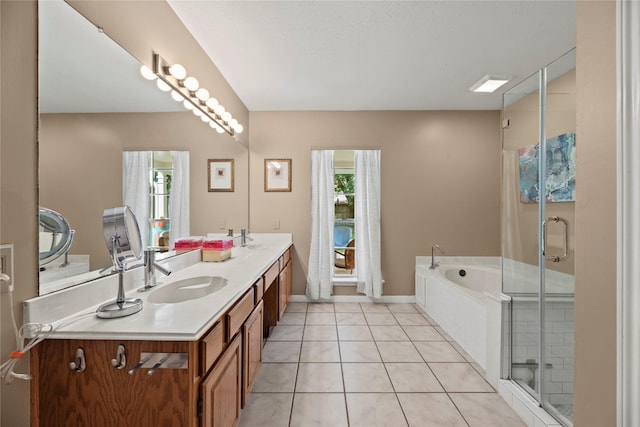 7615 Sandygate Ln, Houston, TX 77095 - full bath with plenty of natural light, double vanity, a bath, and tile patterned flooring