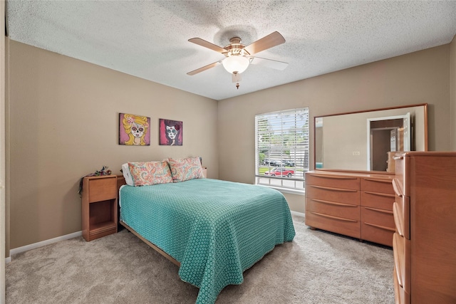 7615 Sandygate Ln, Houston, TX 77095 - bedroom featuring light colored carpet, a ceiling fan, and a textured ceiling