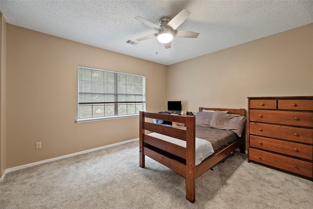7615 Sandygate Ln, Houston, TX 77095 - carpeted bedroom featuring a textured ceiling and ceiling fan