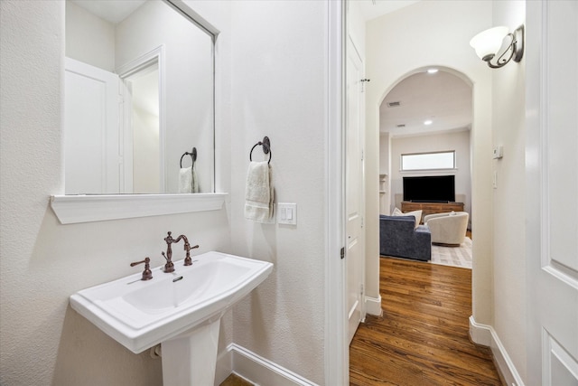 961 Queen Annes Rd, Houston, TX 77024 - bathroom with wood finished floors and a sink