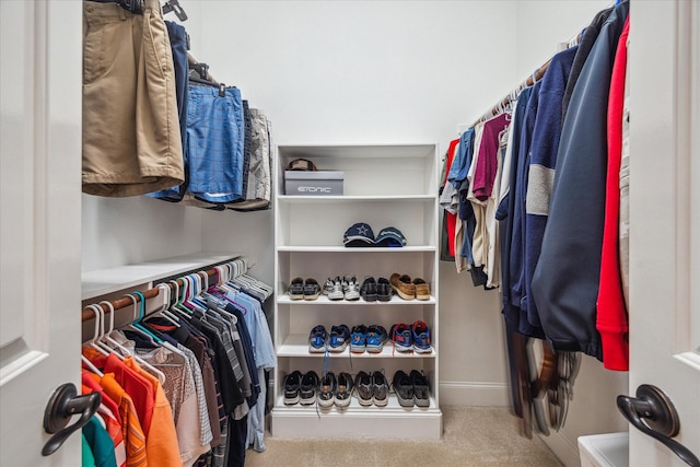 961 Queen Annes Rd, Houston, TX 77024 - walk in closet featuring carpet flooring