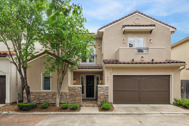 961 Queen Annes Rd, Houston, TX 77024 - mediterranean / spanish-style home with a balcony, stucco siding, a garage, a tile roof, and driveway